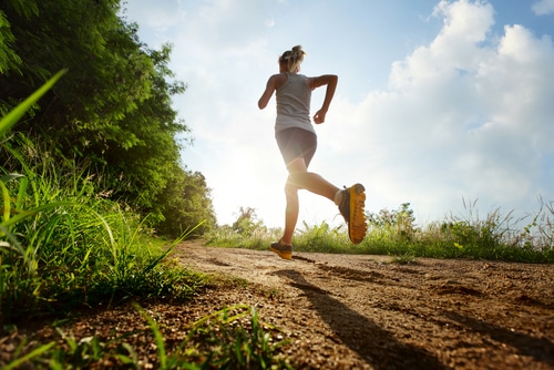 Woman running on a trail